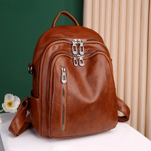 Retro brown PU leather backpack for women with multiple zippers and large capacity
