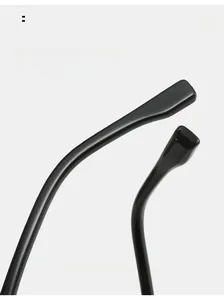 Macro detail of ergonomic curved mirror legs on lightweight TR retro black glasses frame