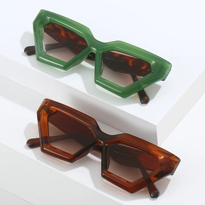 Retro geometric sunglasses in emerald green and amber tortoiseshell with polygonal frames
