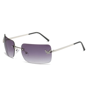 Frameless Y2K sunglasses with purple gradient lenses and rhinestone butterfly accents