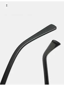 Detail of glossy black ergonomic curved temple tips for comfortable aviator sunglasses