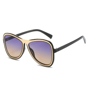 Oversized retro aviator sunglasses with black and gold frames and purple gradient lenses