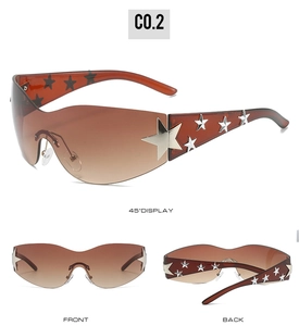 Detail view of Y2K star sunglasses with gradient brown lenses and silver star embellishments