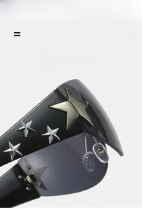 Detail of oversized sunglasses with silver star studs and polished black frames