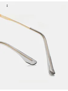 Detail of ergonomic curved metal glasses temple with transparent grey non-slip tips