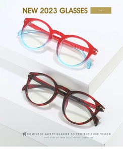 Close-up of stylish round frame glasses in gradient blue and tortoiseshell texture