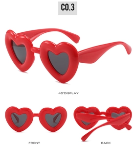 Three perspectives of red heart-shaped Y2K sunglasses with dark lenses on white background
