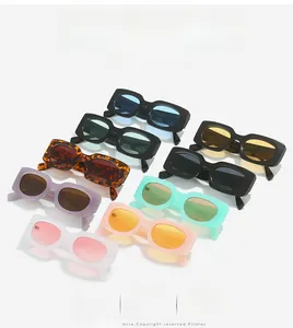 Stack of colorful square retro sunglasses showing various frames and lens colors