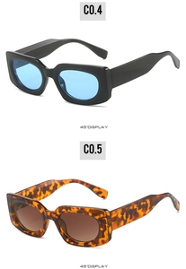 Detail view of rectangular sunglasses in glossy black with blue lenses and tortoiseshell frame