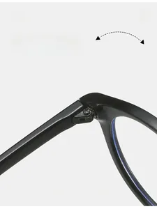 Close-up of durable metal hinge on round black glasses frame with smooth texture