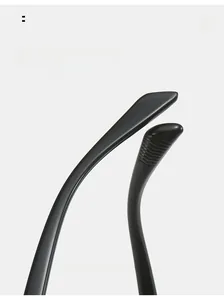 Detail of curved black glossy eyewear temple tips with anti-slip wave texture