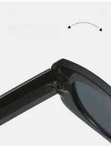 Detail view of durable metal hinge on minimalist square black glossy sunglasses