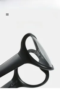 Macro view of black Y2K wrap glasses frame showing high elasticity and texture
