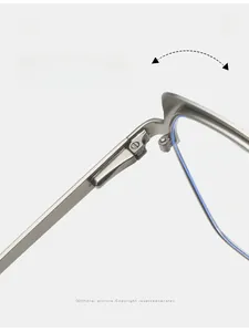 Macro detail of a durable metal hinge on vintage polygonal glasses frames with silver finish