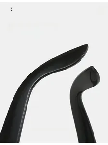 Detail view of the curved mirror legs on Y2K style black glasses for comfortable wear