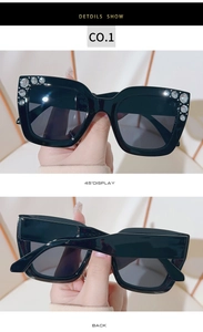 Detail view showing luxury square black sunglasses with sparkling rhinestone embellishments