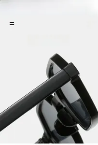 Detail of black rectangular sunglasses featuring lightweight and super elastic frame material