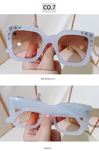Detail view showing 45-degree and back angles of square rhinestone sunglasses