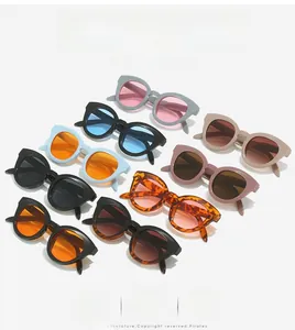Detailed grid of oval sunglasses in various colors featuring thick frames and tinted lenses