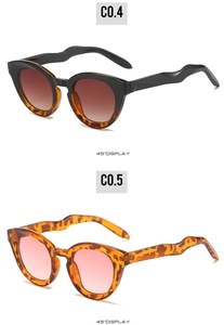 Detail view of oval sunglasses with unique wavy temples and stylish leopard print patterns