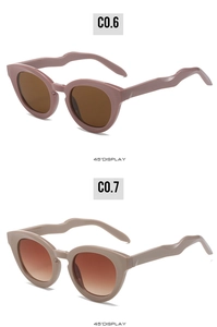 Detail view of oval sunglasses with wavy temples in pink coffee and beige colors