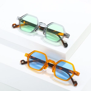Modern hexagonal sunglasses with translucent frames and retro tortoiseshell temples