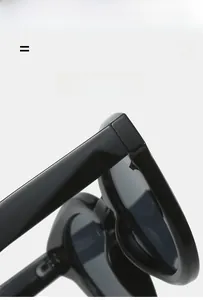 Macro detail of high-quality durable hinges on black oval sunglasses frame