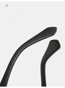 Detail view of ergonomic curved temple legs on black oval sunglasses for comfort