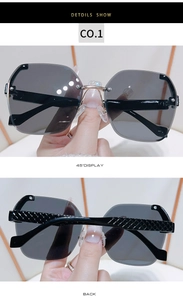 Detail view of rimless sunglasses with gradient lenses and textured metal temples