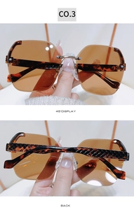 Detail of rimless brown sunglasses showing the 45-degree angle and back view