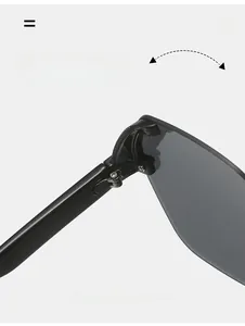 Close-up of durable metal hinge and textured temple on rimless sunglasses