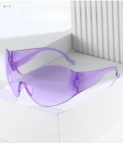 Detail of oversized purple Y2K sunglasses with futuristic frameless shield design