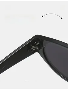 Detailed close-up of reinforced metal hinges on black polished frame sunglasses