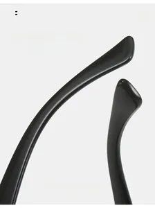 Macro view of ergonomic curved temple legs on sleek black jelly color sunglasses
