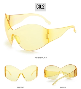 Detailed views of translucent yellow oversized steampunk Y2K sunglasses from multiple angles