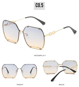 Frameless oversized sunglasses with gradient lenses and chain detail on gold temples