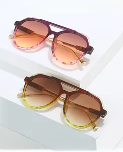 Detail of pilot sunglasses with double bridge and leopard print accents on frames
