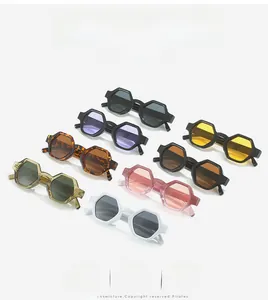 Flat lay display of 8 colorful geometric hexagonal sunglasses in various stylish colors