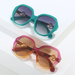 Oval geometric sunglasses with thick frames and gold hollow hardware in green and pink