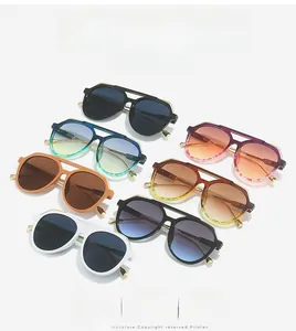 Collection of retro pilot sunglasses with colorful gradient lenses and double bridge design