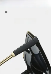 Detail of golden metal hinge on lightweight flexible black pilot sunglasses frame