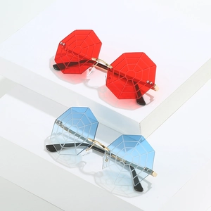 Fashion rimless spider web sunglasses with colorful red and blue tinted lenses