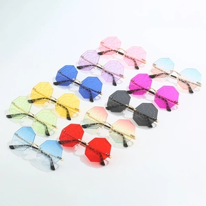 Octagon rimless sunglasses with spider web patterns in diverse colors and gold temples