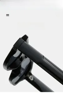 Detail view of glossy black polygonal sunglasses showing durable hinges and curved temples