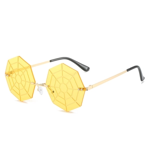Frameless octagonal sunglasses with yellow spider web lenses and gold metal temples