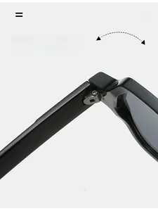 Close-up of durable metal hinge on black polygon sunglasses with polished resin frame