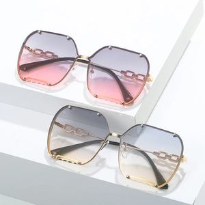 Fashionable rimless oversized gradient sunglasses with metal chain detail for women
