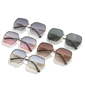 Frameless hexagonal sunglasses with metal rivets and chain temples in five gradient colors