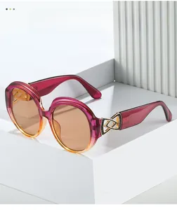 Detail of gradient acetate frame sunglasses with golden geometric metal joint on the temple