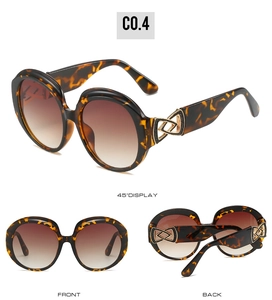 Detailed views of oval tortoise sunglasses with brown gradient lenses and gold accents